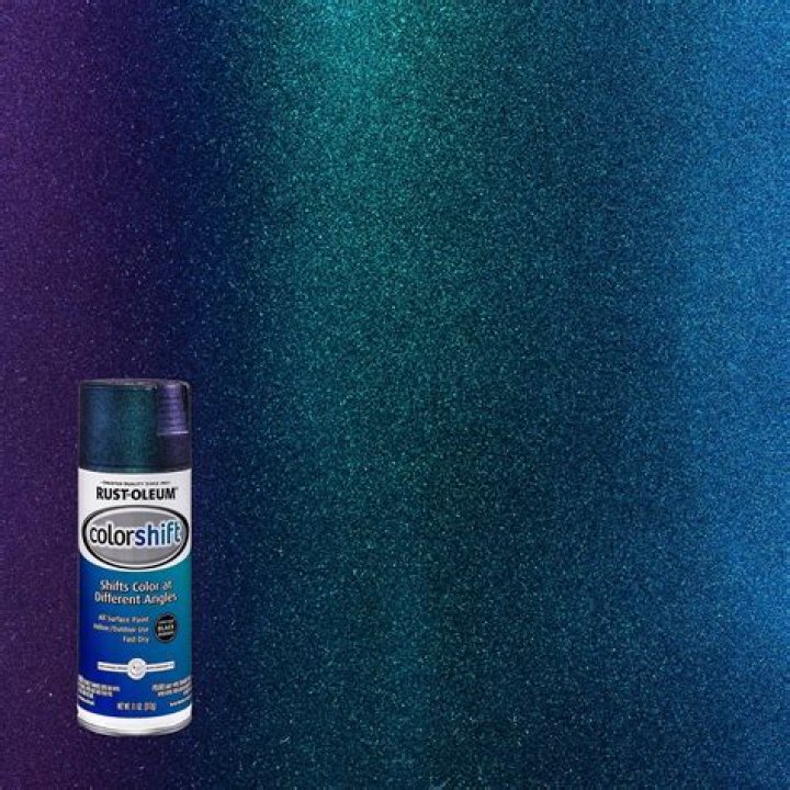 A blue and green spray tan bottle