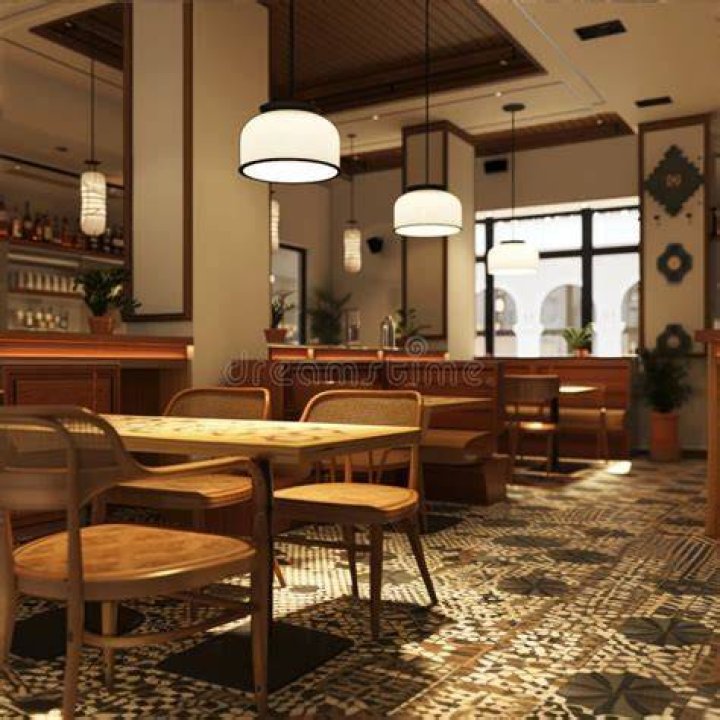 A restaurant room filled with plants and lights