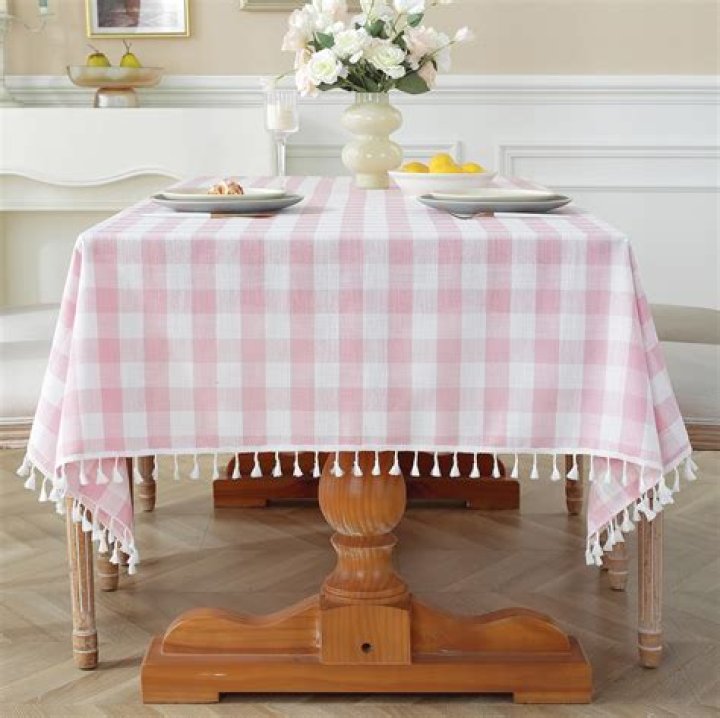 A table covered with small floral arrangements