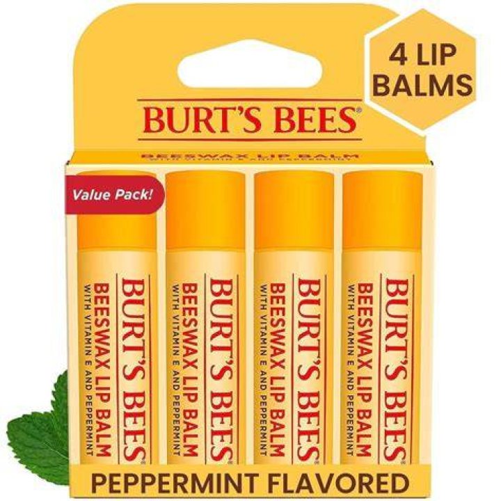 A yellow lip balm with a white cap