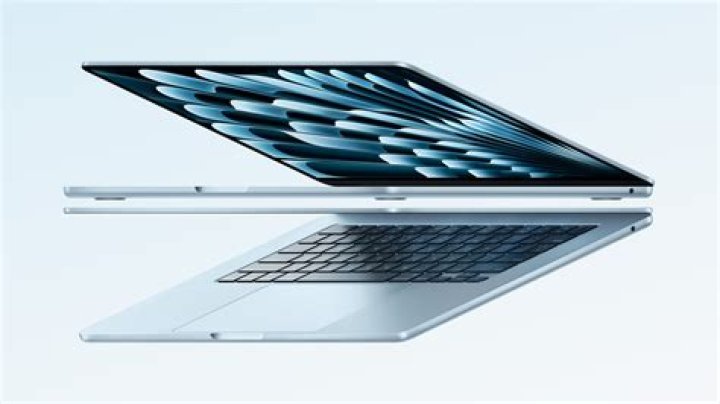 Apple MacBook Air M1 open showing colorful photos Apple MacBook Air M1 open showing colorful photos