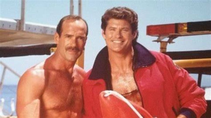 Baywatch star David Hasselhoff sober and smiling in only a pair of red boardshorts hosts an event at Malibu's Polaroid beach house for his charity "Club Baywatch". The charity which exposes underprivileged children to the ocean and water activities played host to a party of about 20 children and family for the day. David is seen posing with one of Baywatch's producers infront of a artistic sand castle with a board of keys both called " Keys to the castle " before he took a dip in the ocean only to get his ears full of water. He is also seen with former Baywatch star David Chokachi taking pictures of some of the children before bursting into fits of laughter. "The Hoff" also took the opportunity to promote his new show Americas Got Talent by dressing the children in shirts with the shows slogan. Picture by: HotShots Worldwide/Splash News Ref: HSW 050807 A Splash News and Pictures Los Angeles: 310-821-2666 New York: 212-619-2666 London: 207-107-2666 