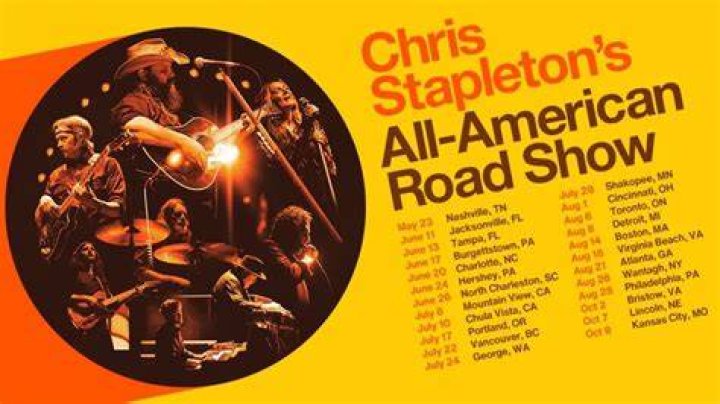 chris stapleton in concert with smoke around him