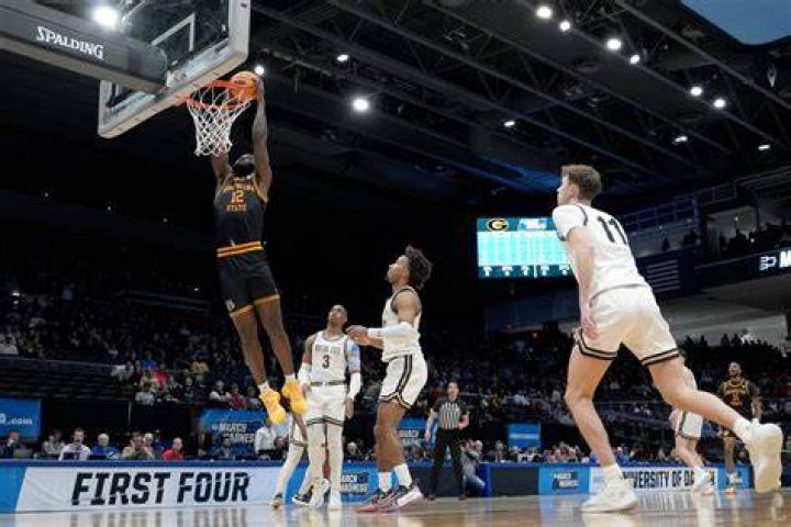 DAYTON, OHIO - MARCH 20: KJ Simpson #2 of the Colorado Buffaloes drives against Roddie Anderson #0 of the Boise State Broncos during the First Four round of the 2024 NCAA Men's Basketball Tournament held at University of Dayton Arena on March 20, 2024 in Dayton, Ohio.