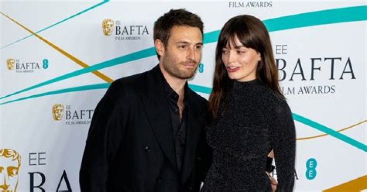 Emma Mackey poses on red carpet of BAFTAs