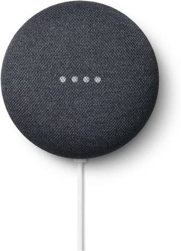 Google Nest Audio mute switch Google Nest Audio in black on nightstand next to bed