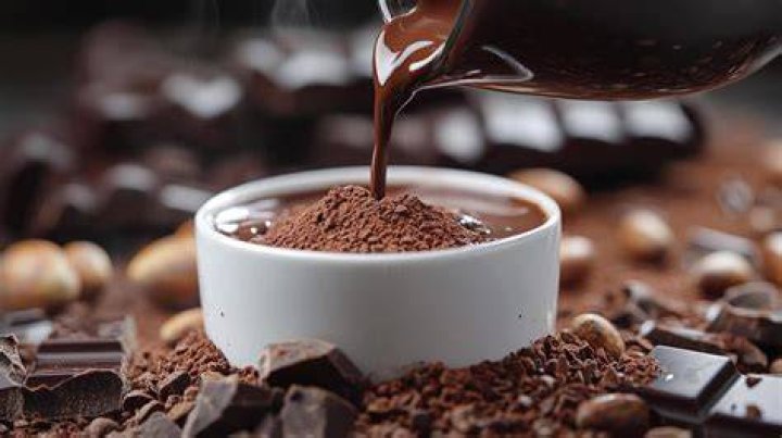 Hot chocolate being poured into a mug