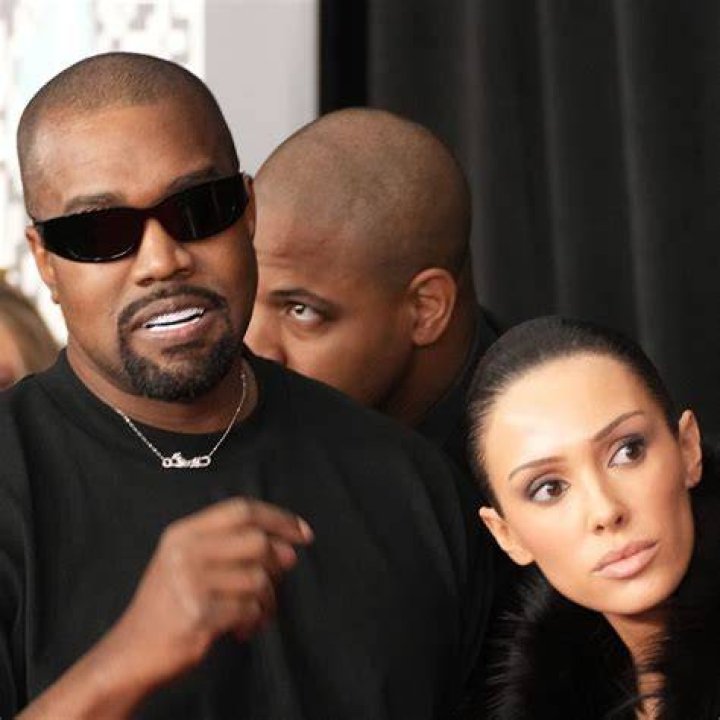 Kanye gets down on one knee on a baseball field proposing to Kim Kardhasian
