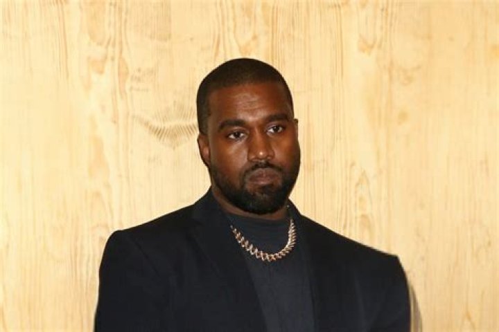 Kanye West hand on his head