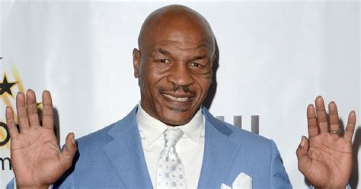 Mike Tyson with his hands up