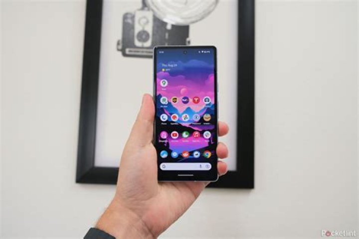 Pixel 5 portrait indoors of man wearing a grey and red shirt