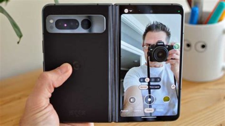 Pixel 5 selfie indoors of man with green walls in background