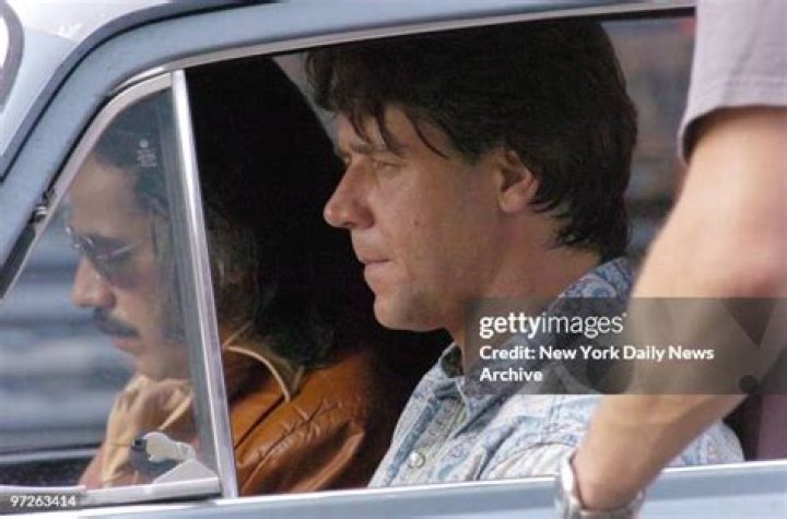 Russell Crowe sits in a blue car in a scene from the movie 'Unhinged'. 