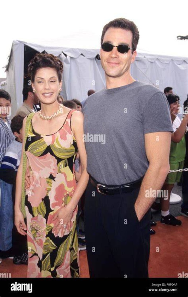 TERI HATCHER with Jon Tenney at Tomorrow Never Dies USA premiere in Los
