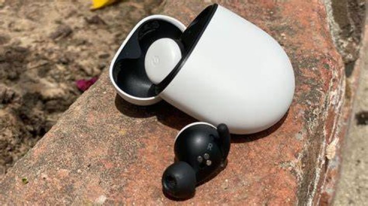 The Google Pixel Buds 2020 true wireless earbuds on top of the charging case.